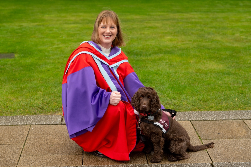 Dr Bronagh Byrne and her service dog at Winter Graduation 2023