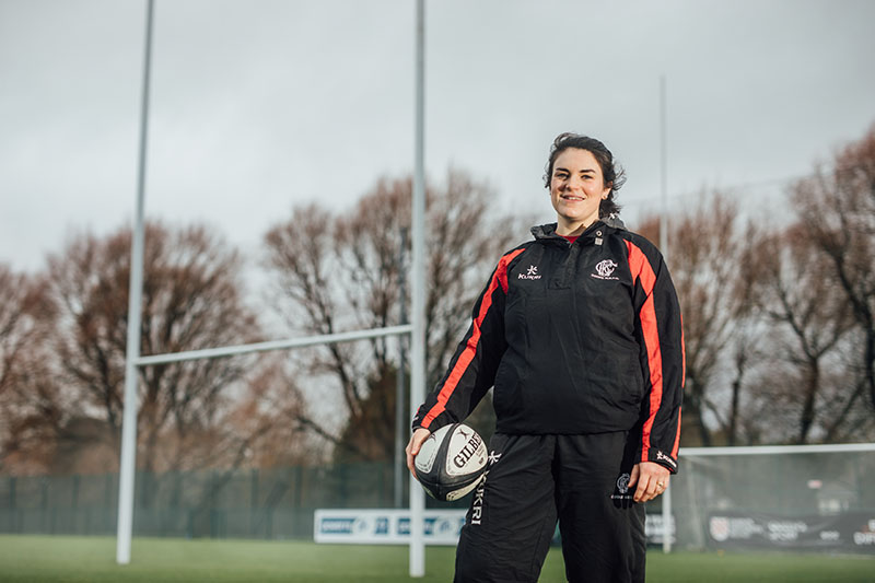Image of staff member in Rugby clothes in Upper Malone Playing Fields, The Dub