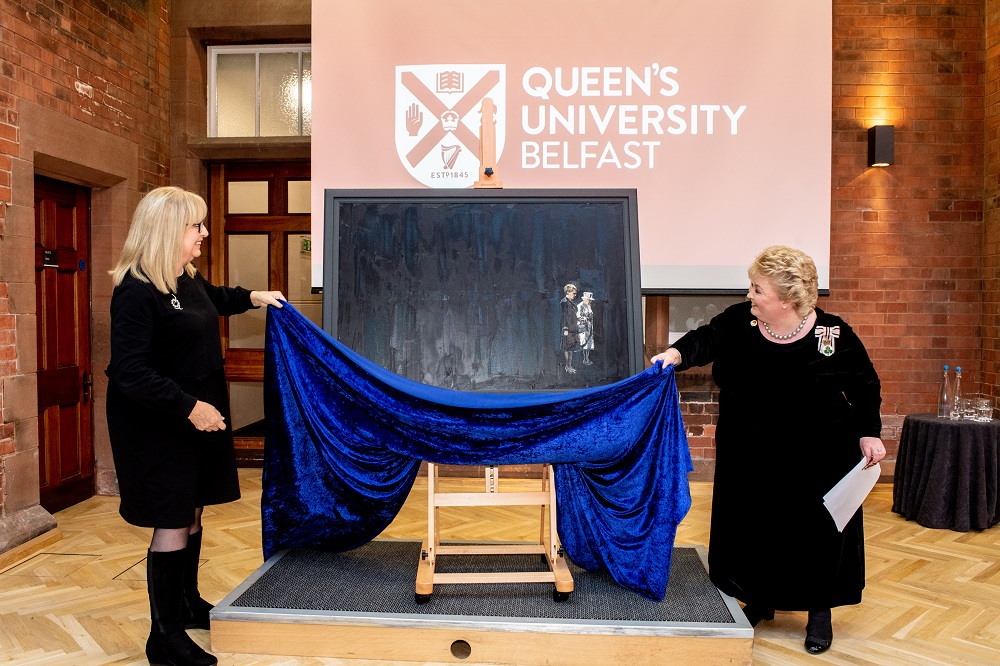 Professor Mary McAleese and Lord Lieutenant Dame Fionnuala Jay-O'Boyle unveiling the portrait of Queen Elizabeth II and McAleese by artist Michelle Rogers