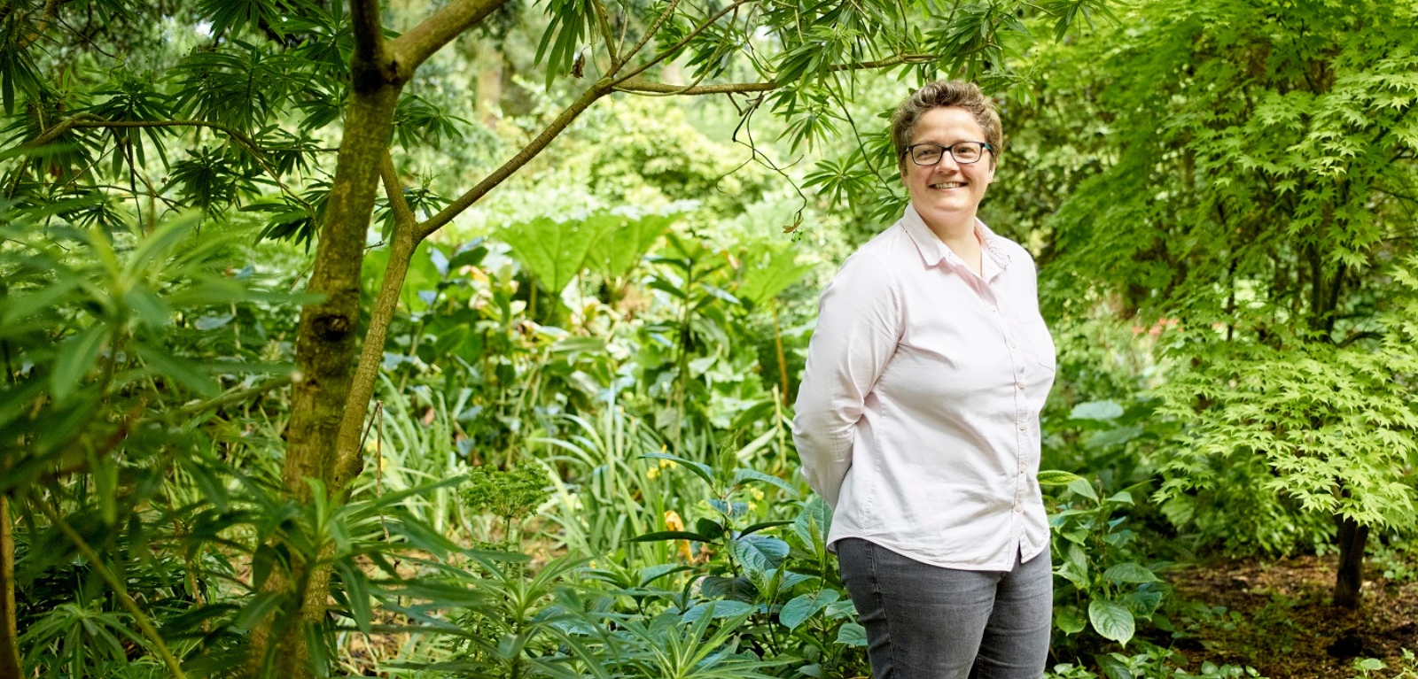 Professor Ruth Hunter surrounded by vegetation