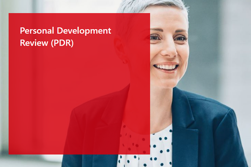 Personal Development Review (PDR) - image shows young professional woman smiling