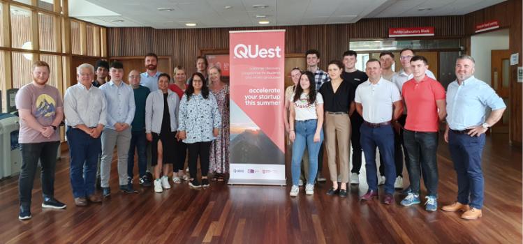 Group photo of the students, graduates and coaches at the QUest Bootcamp