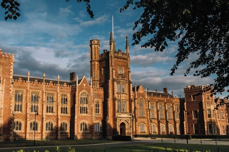 Queen's Lanyon Building in early morning or late afternoon sunshine, between spring and autumn