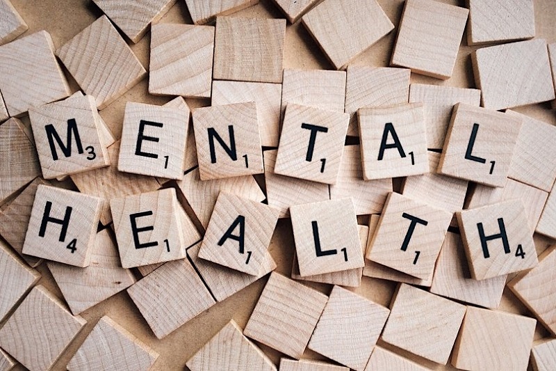 wooden, Scrabble-like chips spelling out 'Mental Health'