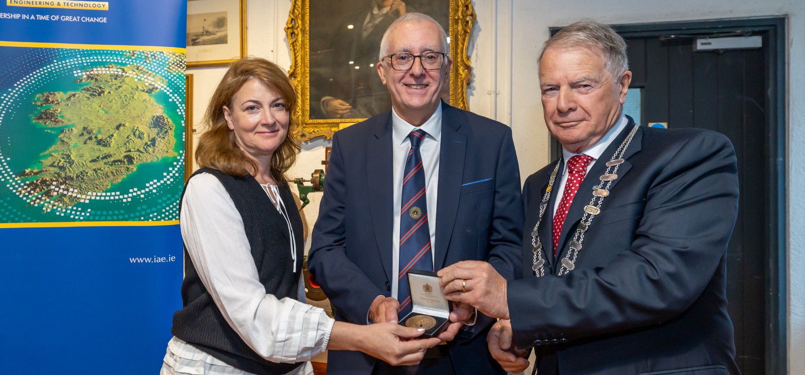 Professor Fusco proudly holding his award medal, smiling, after receiving it from the IAE. Image copyright IAE, Birr Castle Demesne and Paul Moore.