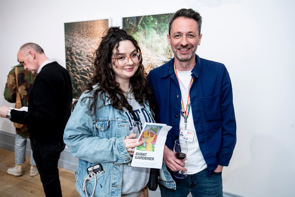 smiling woman and man in an art gallery